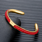 Braided leather and stainless steel cuff bracelet in gold / red