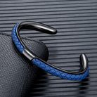 Braided leather and stainless steel cuff bracelet in black / blue