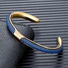 Braided leather and stainless steel cuff bracelet in gold / blue