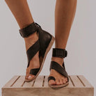 Cross strap toe ring flat sandal in black