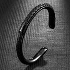 Braided leather and stainless steel cuff bracelet in black / black