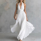 Plunging halter open back pleated maxi dress in white